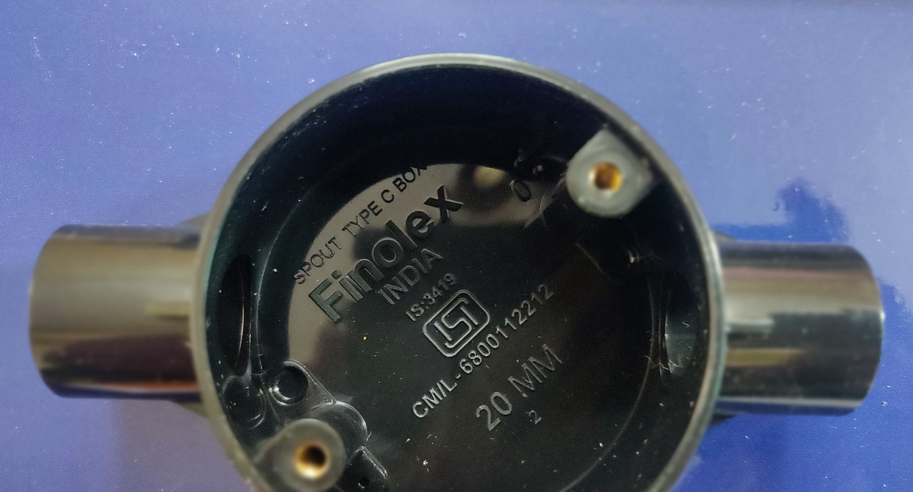 Finolex 4-way circular electrical-conduit box (20 mm, Type C) marked with the ISI logo, IS:3419 standard, and BIS licence CM/L-6800112212